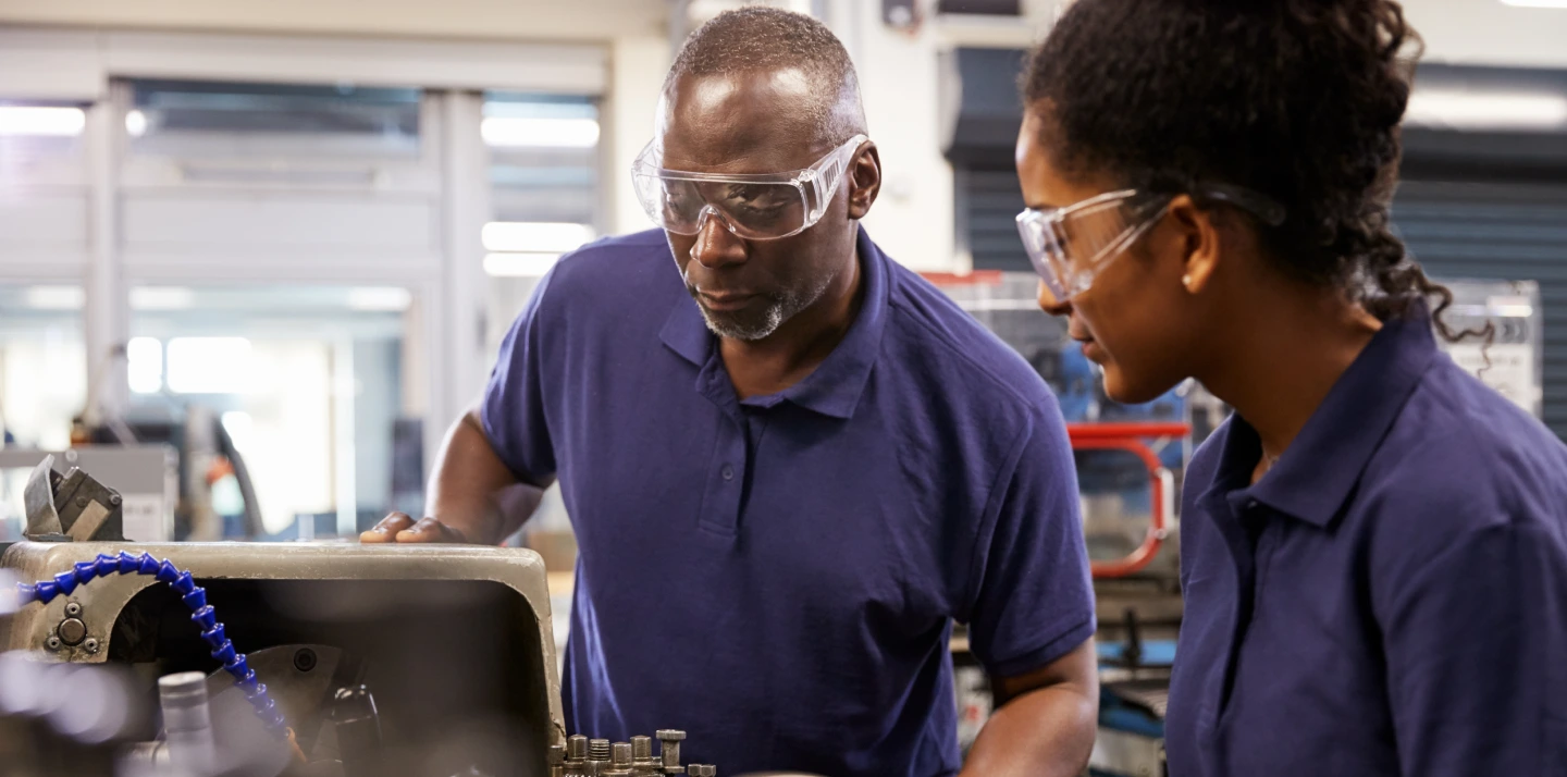 Workers collaborating in industrial setting
